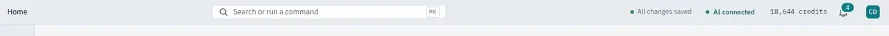 The top bar: breadcrumbs, search, save status, AI status and credits